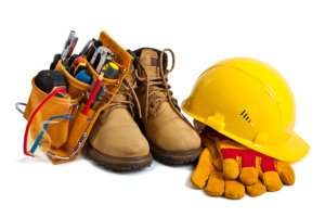 The building tools and protective means. Working boots, tools, building helmet, goggles and gloves