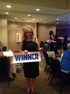 Cindy Voyles, Tamaya Sales Associate accepts another award