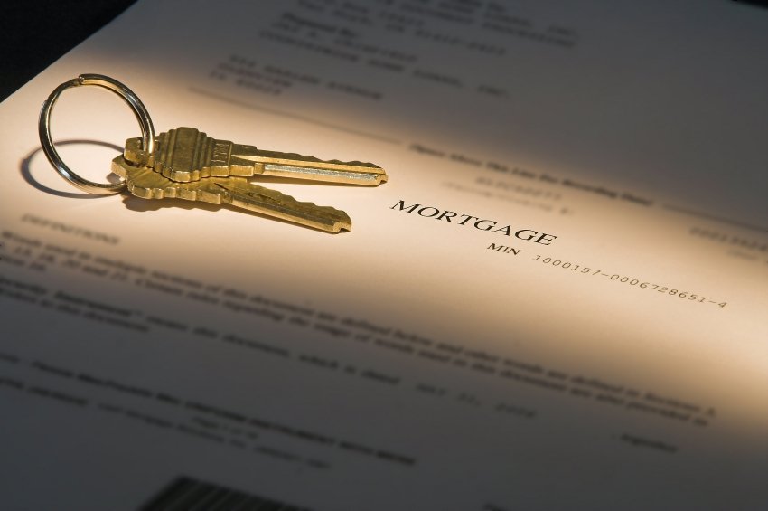 highlighted mortgage document and house keys