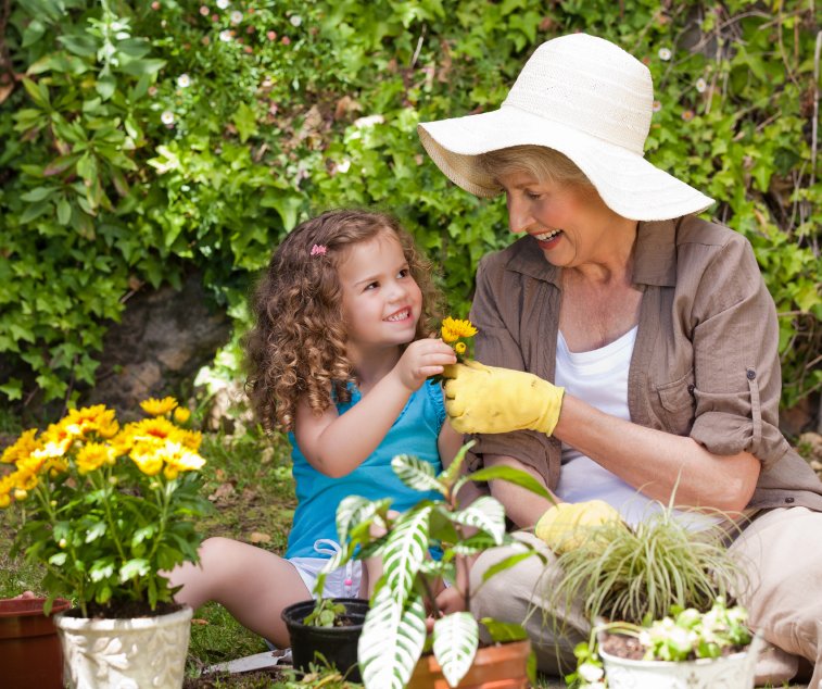 Enjoy Container Gardening, Not Lawn Chores - Grandmother daughter in garden