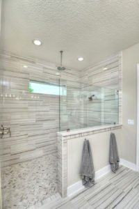 Walk-in shower with half-wall